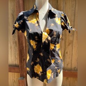 Fun, feminine, flirty short sleeve blouse. Black w/ gold floral pattern. Size 8.